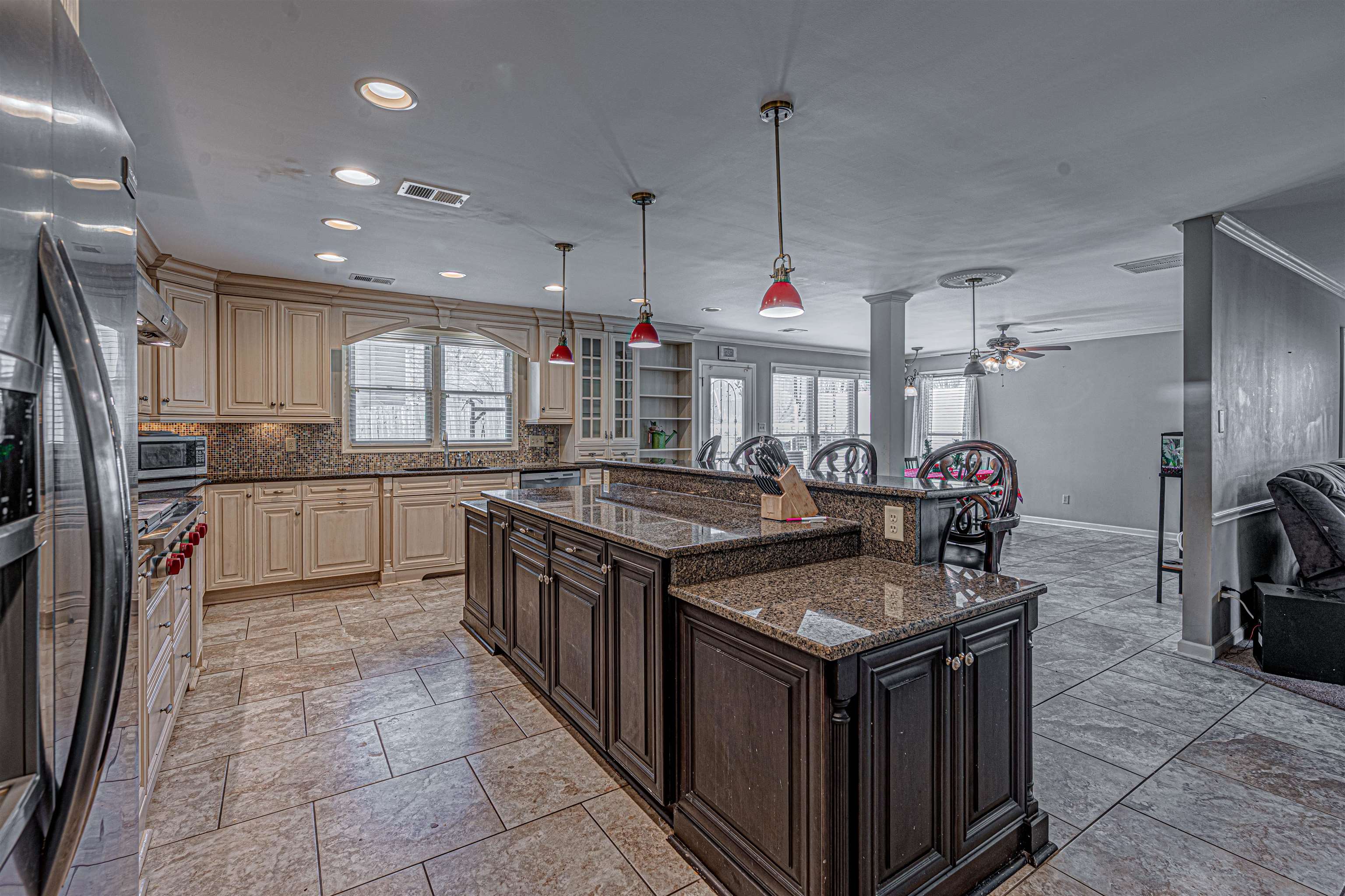 765 Pine Grove Cove Collierville, TN 38017 - Photo 9 of 31 a kitchen with granite countertop a sink stove and refrigerator