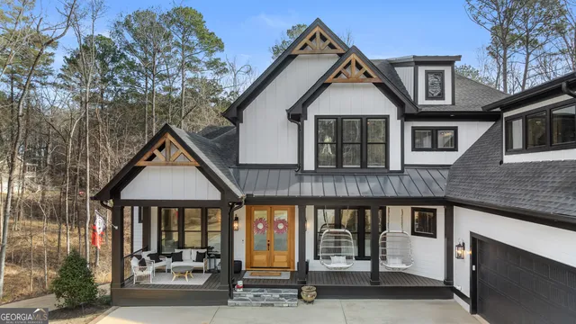 a living room with lots of furniture and a wooden floor