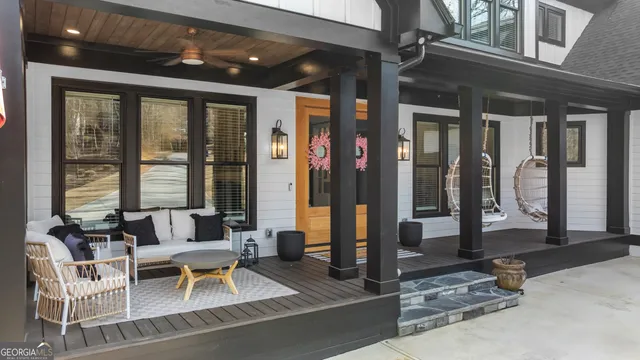 a living room with furniture fireplace and flat screen tv