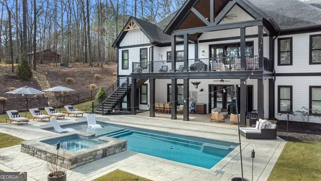 a kitchen with stainless steel appliances a sink stove and cabinets