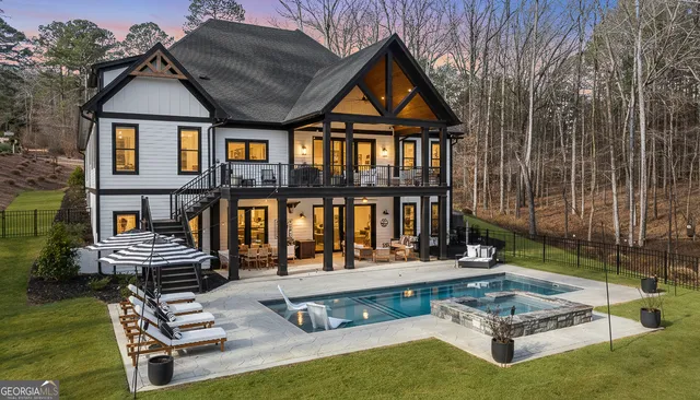 a view of swimming pool with outdoor seating