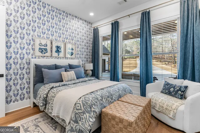 a view of a building with sitting area and garden