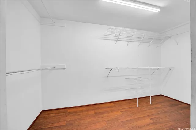a kitchen with sink and view of living room