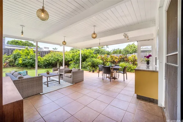 a patio with patio couch and table