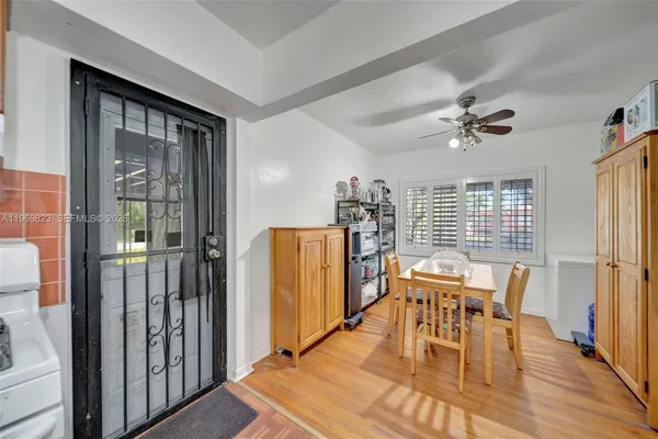 a view of a dining room with furniture and window