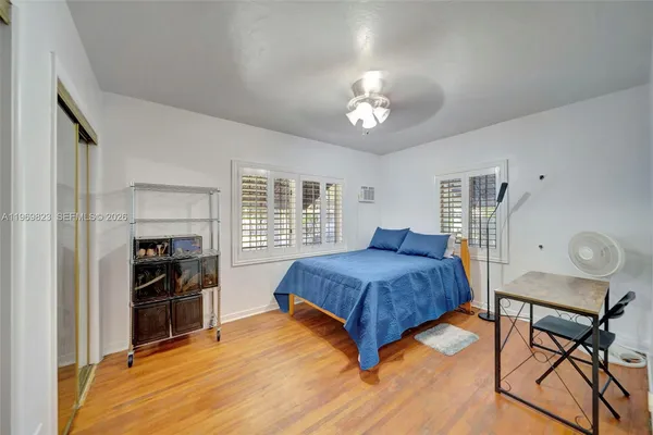a bathroom with a toilet a sink and tub