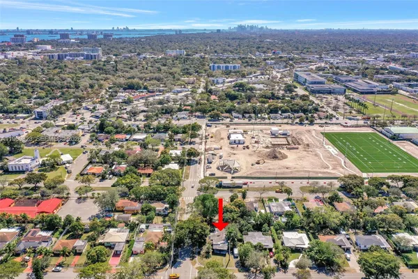 an aerial view of a houses with yard