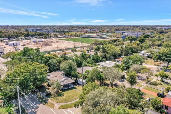 a view of house with outdoor space and swimming pool