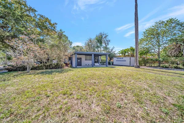 a bedroom with furniture or couch and a flat screen tv