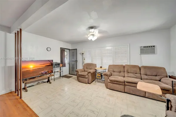 a kitchen with refrigerator cabinets and window