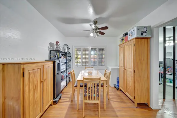 a living room with furniture flat screen tv and couches