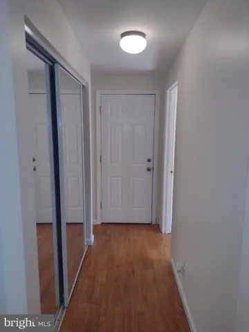 a view of entryway with wooden floor