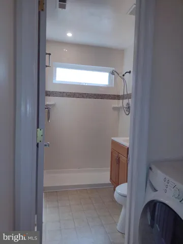 a bathroom with a shower and toilet