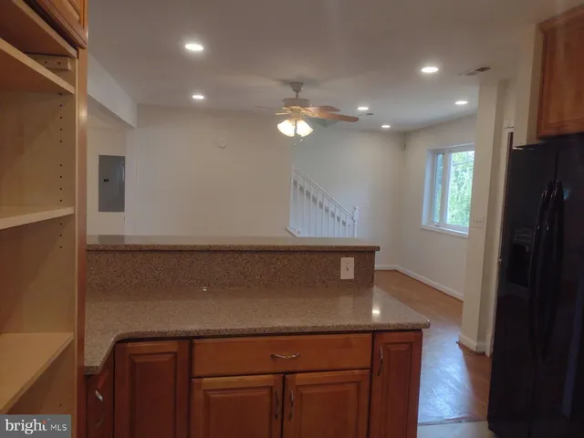 a view of room with window and wooden floor