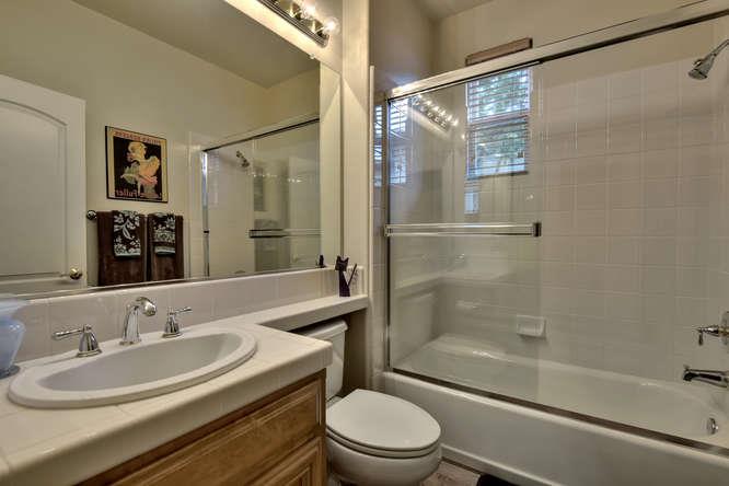 2820 Club Drive Gilroy, CA 95020 - Photo 16 of 43 a bathroom with a sink toilet and shower