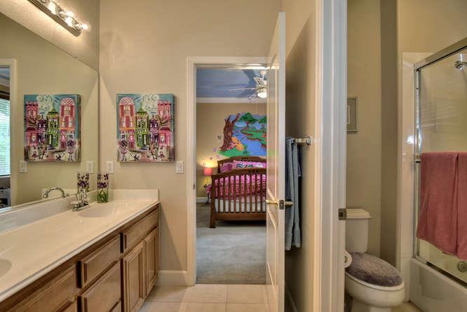 2820 Club Drive Gilroy, CA 95020 - Photo 27 of 43 a en suite bathroom with a sink mirror and toilet