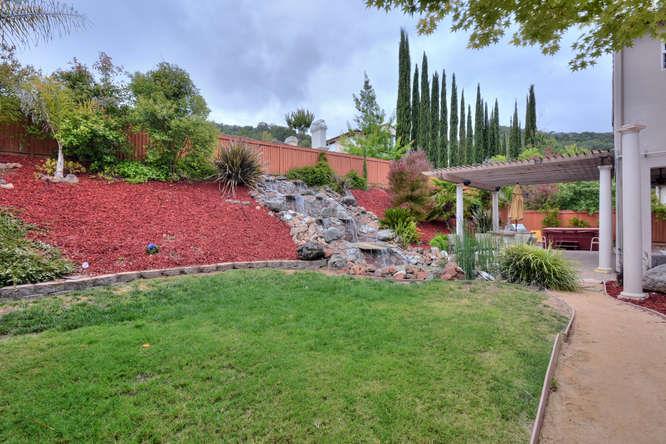 2820 Club Drive Gilroy, CA 95020 - Photo 30 of 43 a view of a garden with a building in the background