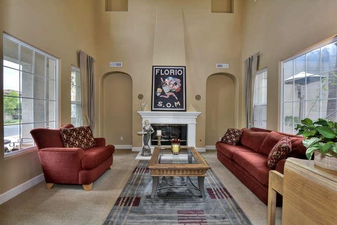 2820 Club Drive Gilroy, CA 95020 - Photo 5 of 43 a living room with furniture fireplace and a large window