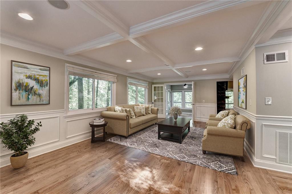 975 Timber Lake Trail Cumming, GA 30041 - Photo 11 of 82 a living room with furniture and a large window
