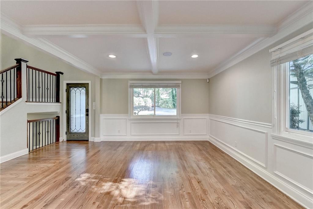 975 Timber Lake Trail Cumming, GA 30041 - Photo 14 of 82 a view of an empty room with wooden floor and a window