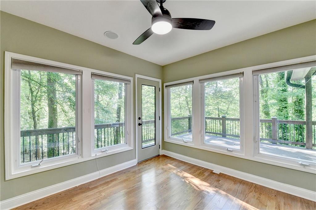 975 Timber Lake Trail Cumming, GA 30041 - Photo 16 of 82 a view of an empty room with wooden floor and a window