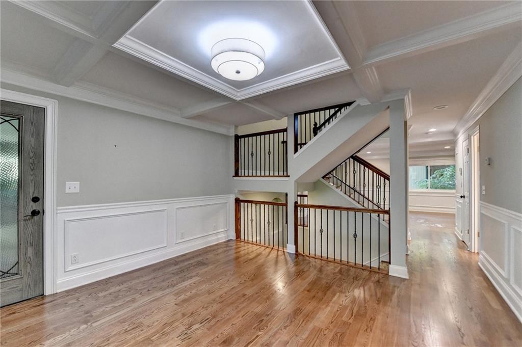 975 Timber Lake Trail Cumming, GA 30041 - Photo 34 of 82 a view of staircase with wooden floor and a window