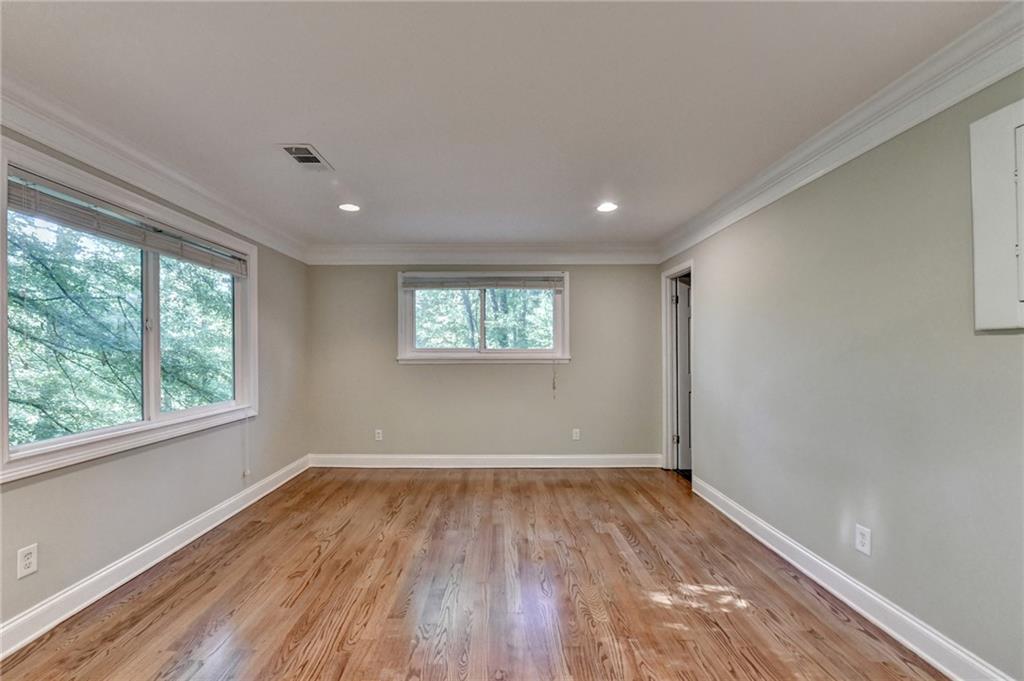 975 Timber Lake Trail Cumming, GA 30041 - Photo 39 of 82 an empty room with wooden floor and windows