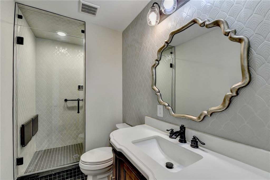 975 Timber Lake Trail Cumming, GA 30041 - Photo 42 of 82 a bathroom with a sink toilet and shower