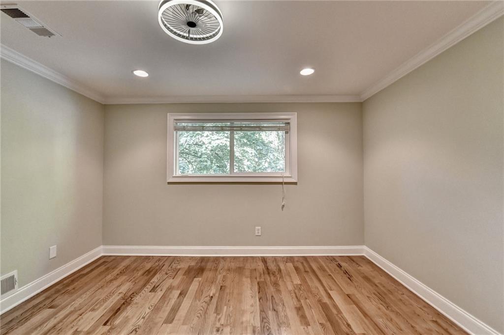 975 Timber Lake Trail Cumming, GA 30041 - Photo 44 of 82 an empty room with wooden floor and windows