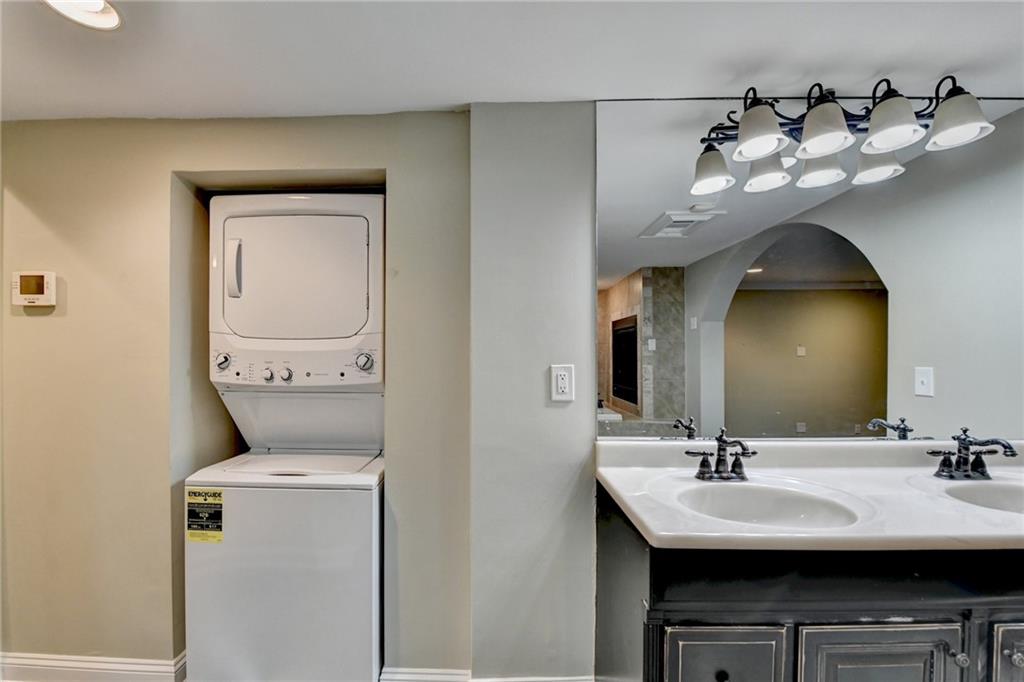 975 Timber Lake Trail Cumming, GA 30041 - Photo 51 of 82 a en suite bathroom with a sink and a mirror