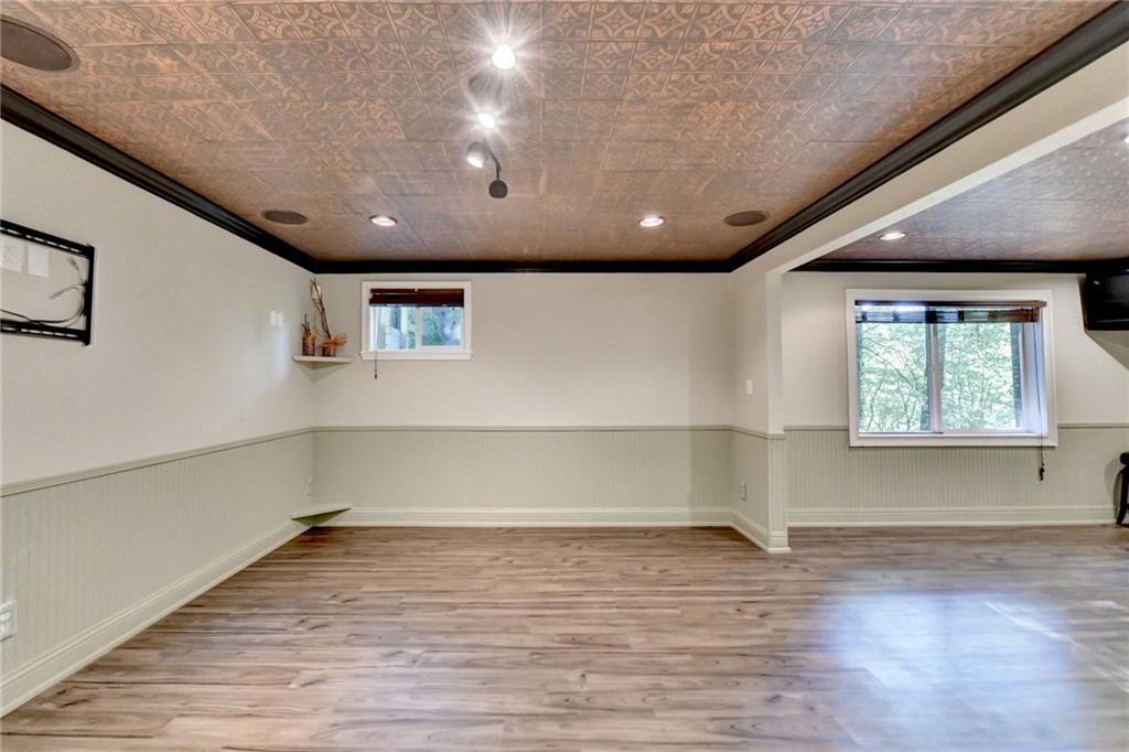 975 Timber Lake Trail Cumming, GA 30041 - Photo 60 of 82 an empty room with wooden floor and windows