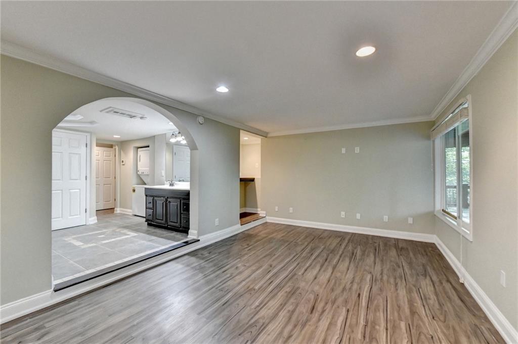 975 Timber Lake Trail Cumming, GA 30041 - Photo 69 of 82 a view of an empty room with wooden floor and a window