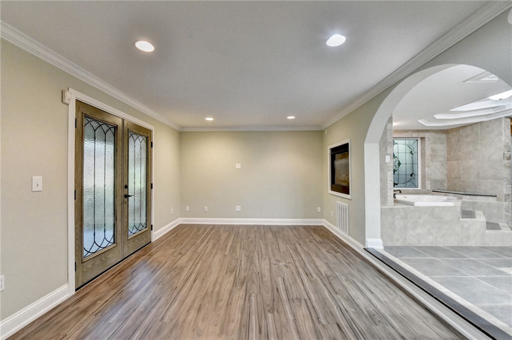975 Timber Lake Trail Cumming, GA 30041 - Photo 70 of 82 wooden floor in an empty room with a window