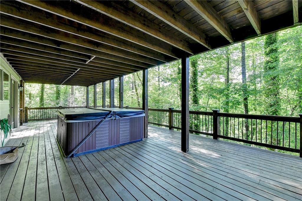975 Timber Lake Trail Cumming, GA 30041 - Photo 72 of 82 a view of porch with wooden floor and outdoor seating