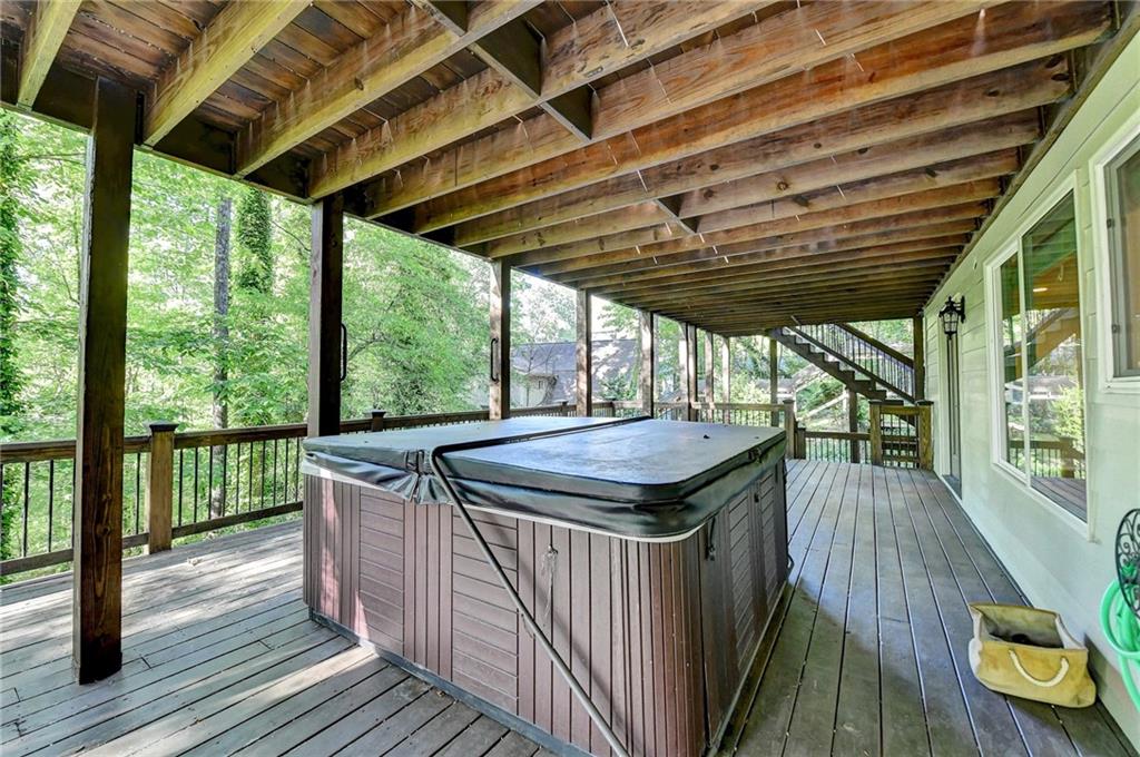 975 Timber Lake Trail Cumming, GA 30041 - Photo 73 of 82 a view of a balcony with furniture and wooden floor