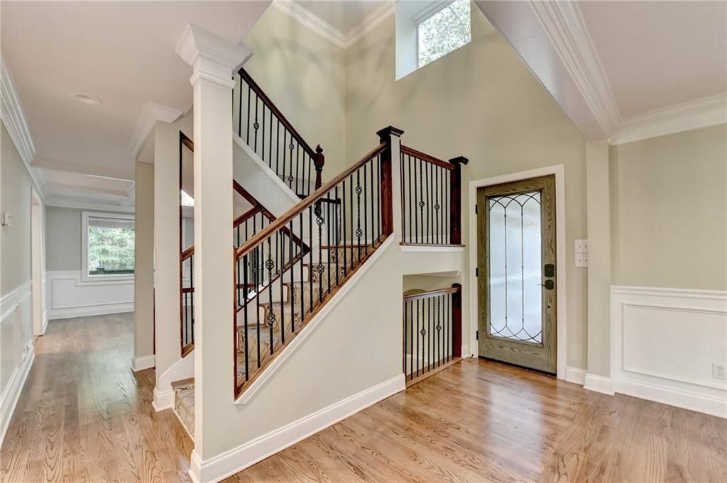 975 Timber Lake Trail Cumming, GA 30041 - Photo 9 of 82 a view of an entryway with wooden floor and windows