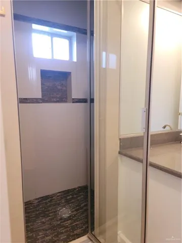a bathroom with a sink and mirror