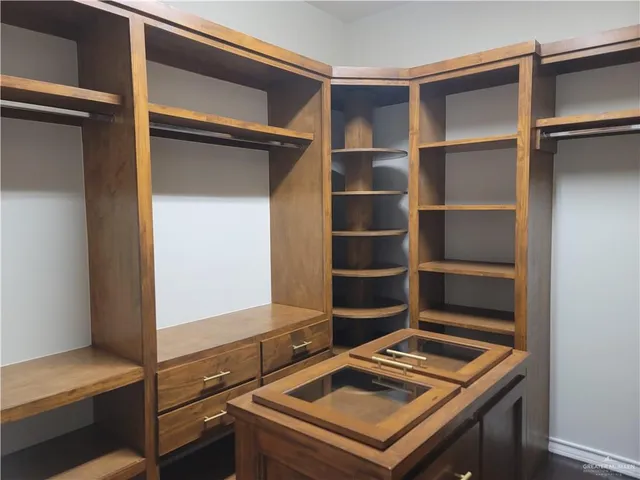 a view of storage and utility room with wooden floor