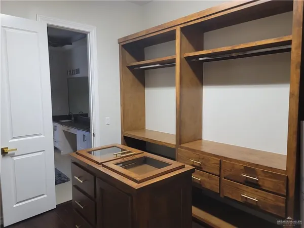 a view of storage and utility room with washer and dryer