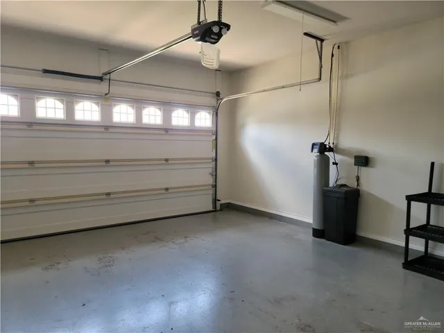 a view of empty room with ceiling fan