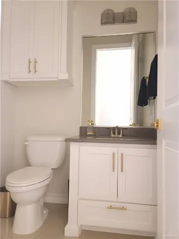 a view of a kitchen with a sink and chandelier