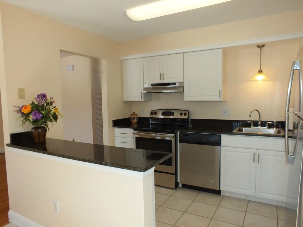 93 Kent Court, Unit 93 Meriden, CT 06450 - Photo 3 of 27 a kitchen with stainless steel appliances a sink and cabinets