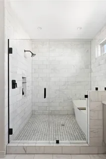 a bathroom with a shower and a toilet