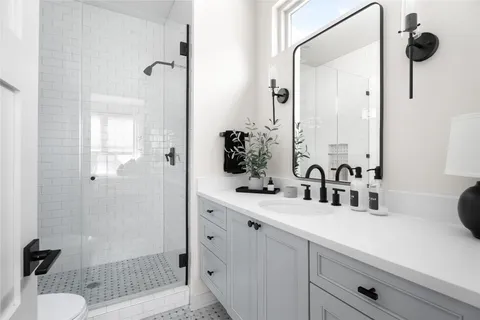 a bathroom with a sink and mirror
