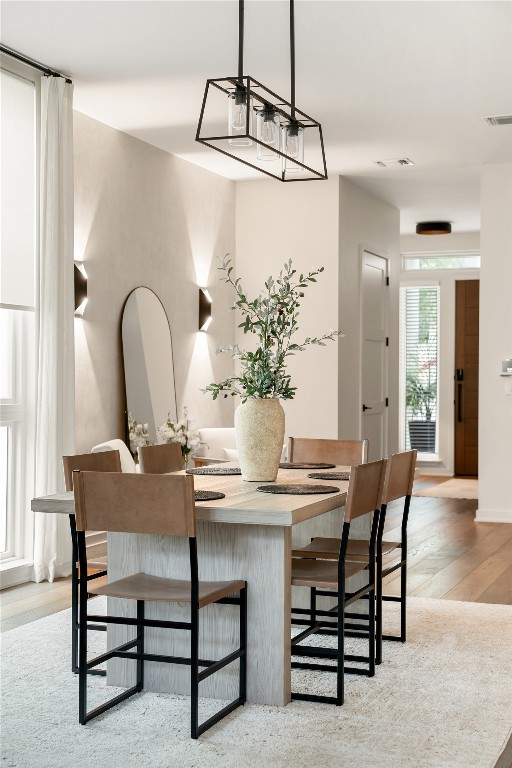 2518 Watkins Way Austin, TX 78746 - Photo 10 of 36 a view of a dining room with furniture and wooden floor