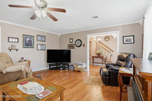 a living room with furniture and a flat screen tv