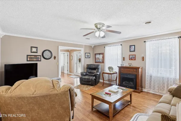 a living room with furniture and a fireplace
