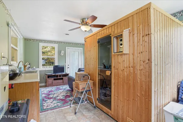 a bedroom with furniture and a window