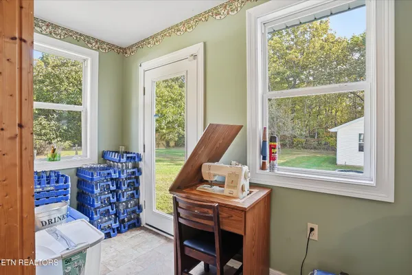 a living room with furniture and a window
