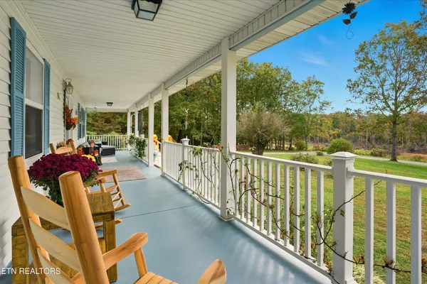 a view of balcony with furniture